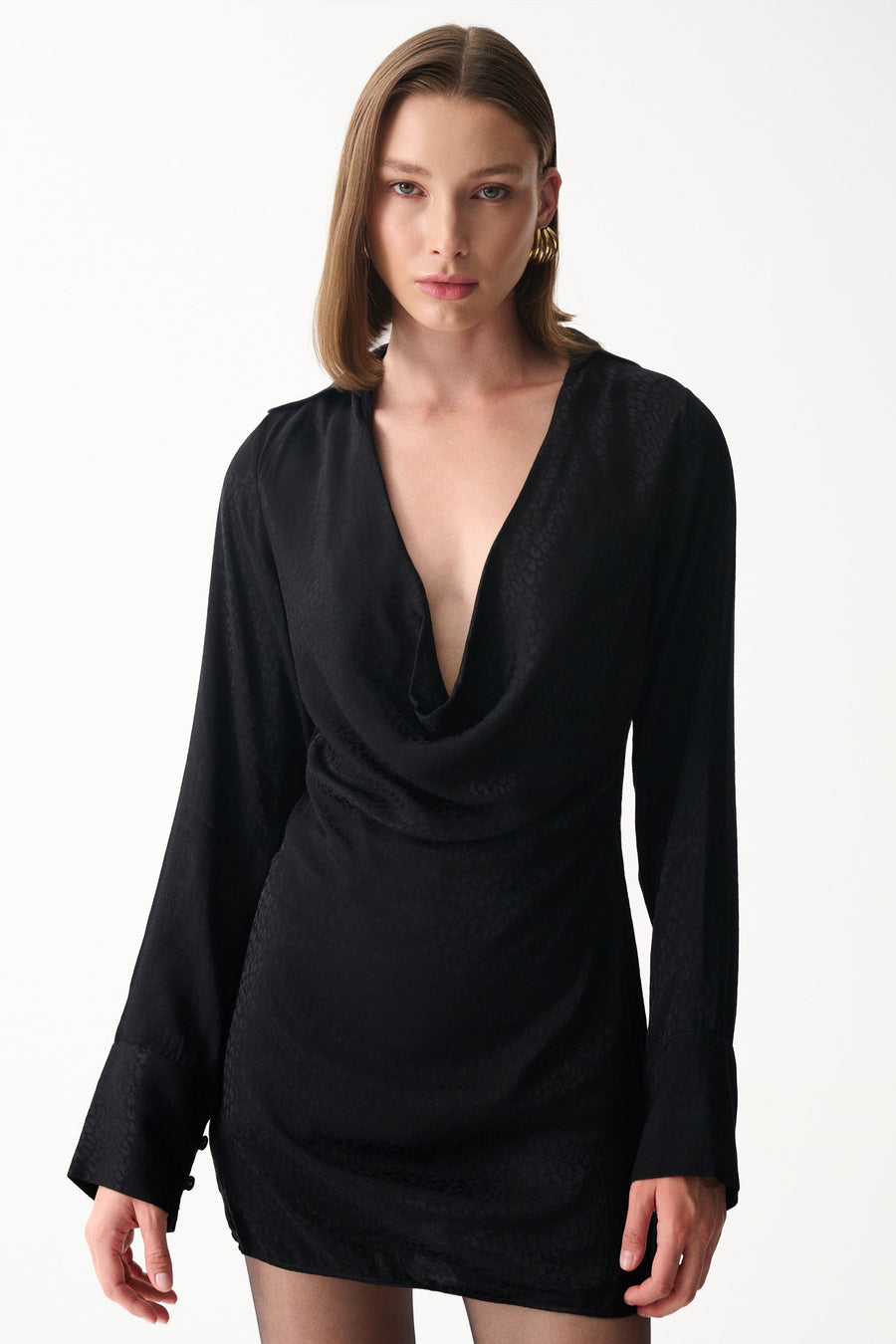 Black satin mini draped neckline dress with subtle jacquard texture, long sleeves and deep V front